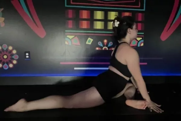 Miranda practicing yoga for wellness