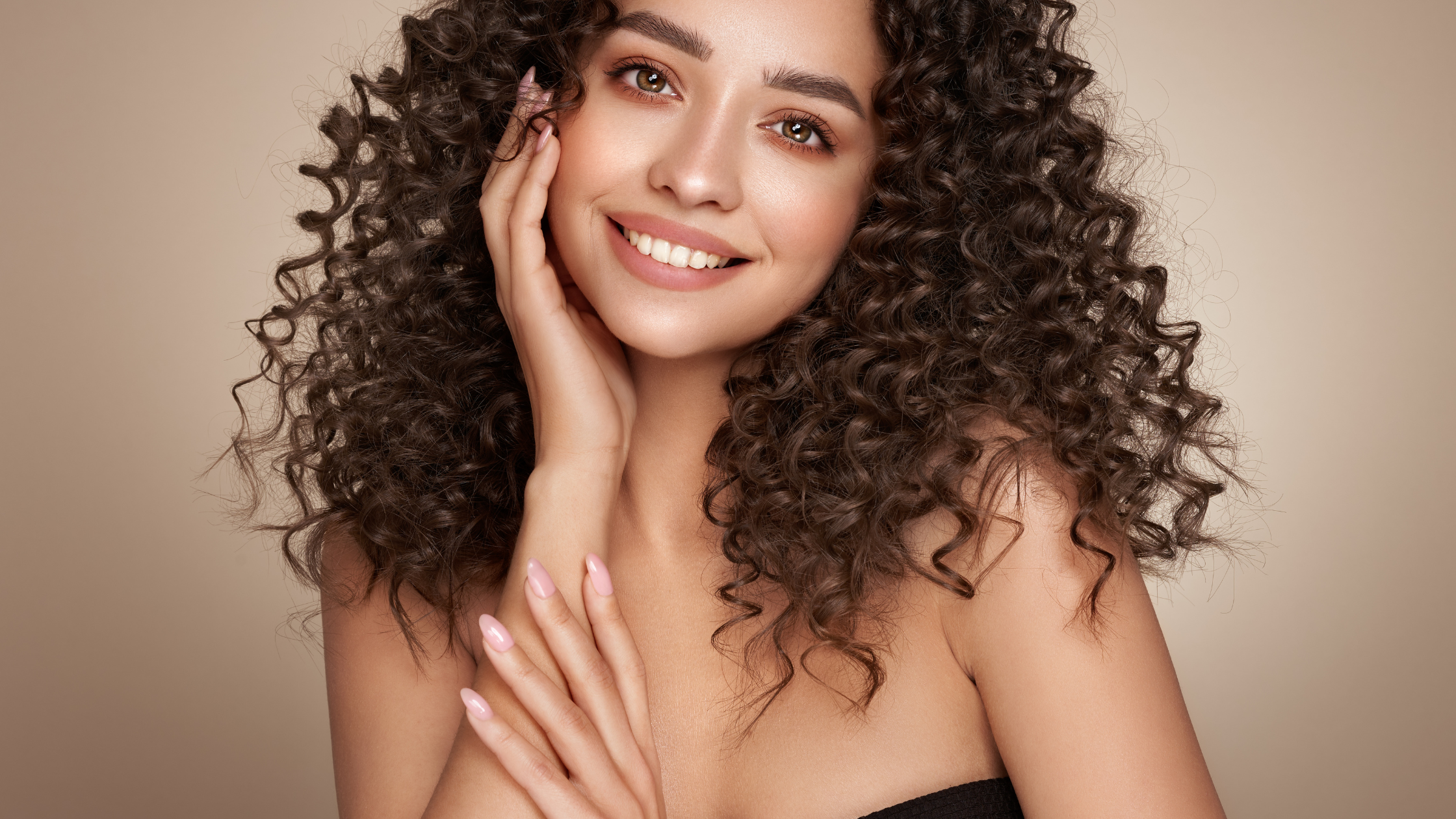 A radiant woman with glowing, hydrated skin, smiling confidently. Showcasing the benefits of medical spa skin rejuvenation at Beautique Medical Spa in McAllen.