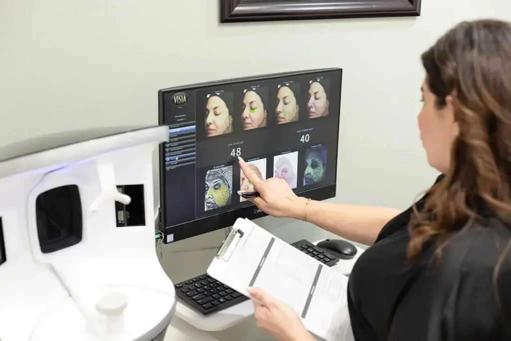 Facials McAllen TX: How to Actually Choose the Right One 4 Beautique Medical Spa VISIA skin analysis scan being reviewed before recommending a facial treatment in McAllen TX