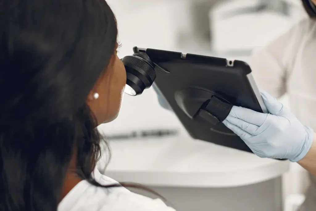 Chemical Peels McAllen TX: Which Type Actually Matches Your Skin Tone 3 Beautique Medical Spa Provider examining a patient's skin closely before recommending a chemical peel type in McAllen TX