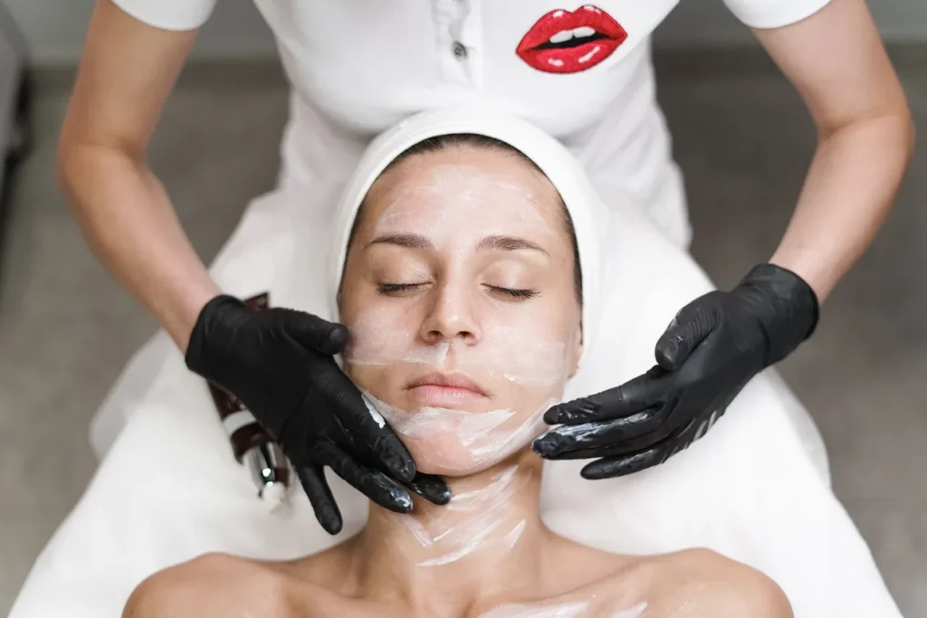 Chemical Peels McAllen TX: Which Type Actually Matches Your Skin Tone 1 Beautique Medical Spa Esthetician performing a chemical peel treatment on a patient's face at a medical spa in McAllen TX