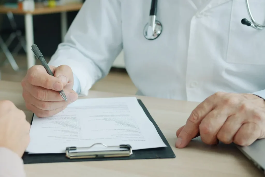 Lip Filler McAllen TX: What to Expect at Your First Visit 3 Beautique Medical Spa Physician reviewing a clipboard with a patient before recommending lip filler in McAllen TX
